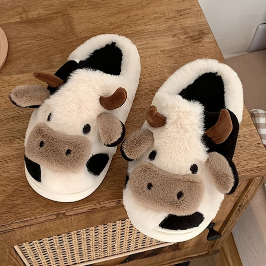 Cow-themed slippers on a wooden surface